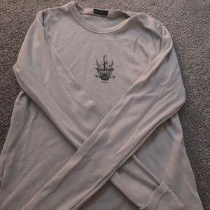 It’s a grey long sleeve top